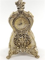 French style champagne colored mantle clock, about