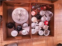 Two boxes including coffee mugs, snack