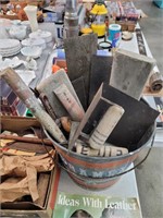 Galvanized bucket full of trowels