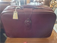 Maroon vintage suitcase