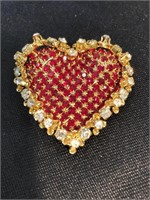 Heart shaped pin with lots of bling. Limited