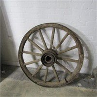 Antique wood steel band wagon wheel.