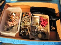 Flat of costume jewelry: necklaces, watch,