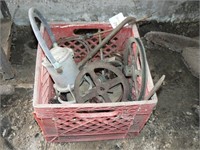Milk crate with contents: railroad lantern,