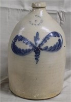 blue decorated stoneware 2 gal jug, signed