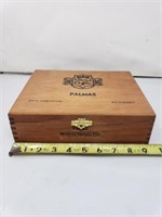 Cigar box with some cigars