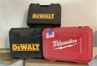 Three empty tool cases, DeWalt and Milwaukee