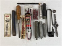 Assorted tools including a screwdriver, chisel,