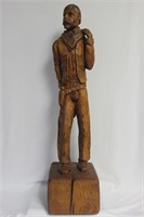 A Wood Statue of a Cowboy