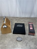 Snap On tool book, belt buckle, and bottle