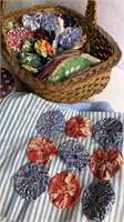 Basket of yoyo quilt pieces & buttons
