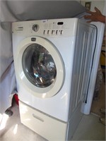 Frigidaire Front load washing machine w base.