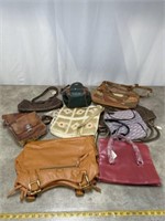 Assortment of hand bags and purses