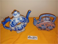 pair of oriental style tea pots