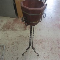 Wrought iron plant stand and wood pot.