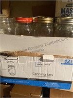 24 canning  jars different sizes