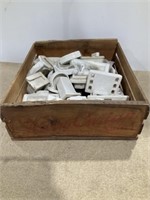 Harry Carian wooden crate, ceramic bathroom