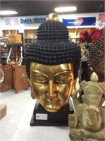 Large golden Buddha head