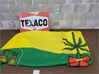 Texico tin sign and a flag