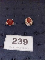 2 sterling rings with coral like stones