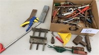 Vise, screwdrivers, wrenches, sharpening stone,