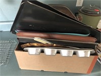 Box of cookie sheets and muffin pan