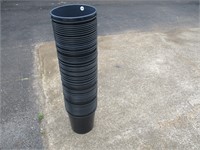 Large Stack of Black Plastic Flower Pots