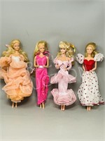 4 Barbie's with fancy outfits