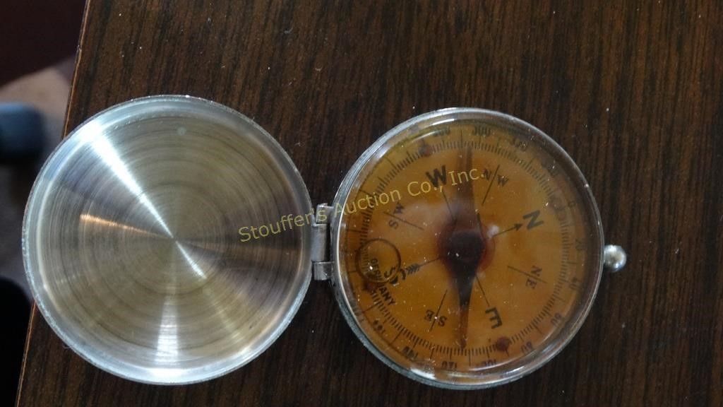Liquid filled compass & cleaning brush