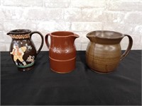 3 Pottery Pitchers, all different makers.