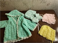 Crocheted baby jacket, hats, booties