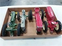 assortment of 1/16 scale tractors with damage