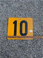 Orange metal number 10 highway sign