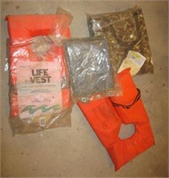 6x8 foot tarp, (2) life vests, & boat cushion.