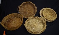 Five round cane baskets