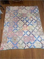 Hand stitched X quilt- does have some tears