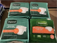 1 LOT (4) DEPENDS DIAPERS WITH TABS AVEC ATTACHES