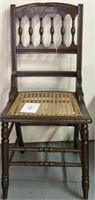 Vintage wooden accent chair; woven seat
