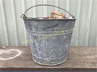 Galvanized bucket with misc supplies