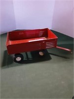 Red pull-behind toy cart