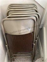 Seven folding chairs