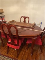 Wooden dining table with four chairs and extra