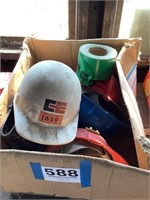 Box of hard hats and caution tape