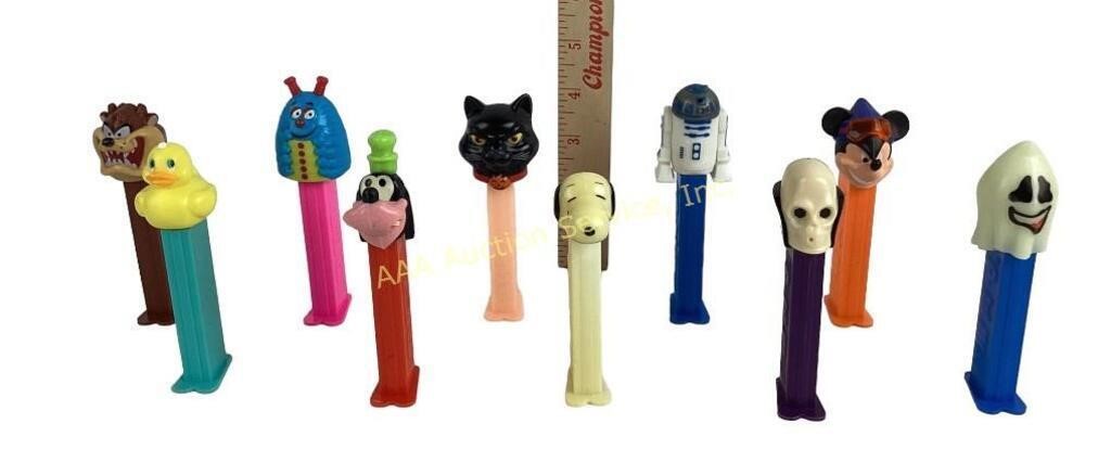 Pez dispensers. Blacked cat, snoopy, love