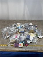 Large assortment of beads and jewelry supplies.