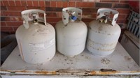 3x propane tanks all seem partially full