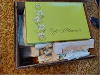 box of tableclothes and linens