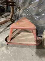 Small metal stool on wheels
