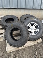 4 Carlisle quad tires, 1 Arctic Cat rim