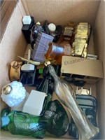 Two boxes of Avon bottles